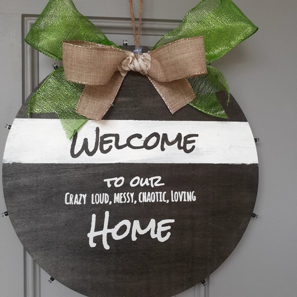 door sign welcome to messy chaotic living home